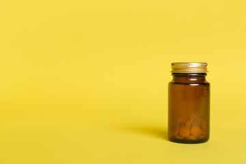 Plastic bottle for vitamins on color background