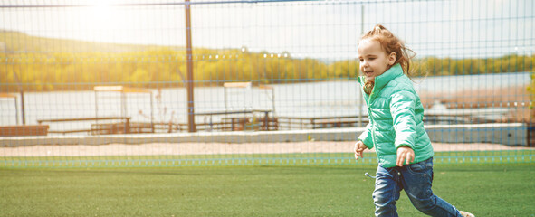 Children run on the playground. Active kid on outdoor. Healthy activity for kids. Banner