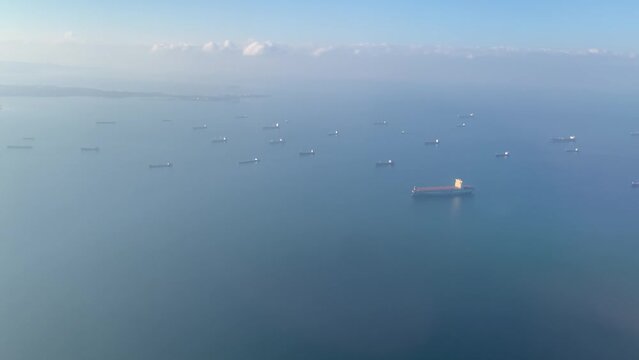 Cargo ships at sea - view from plane from porthole