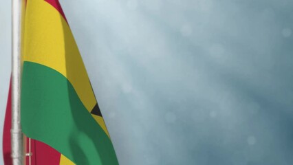 Waving Ghana flag on light blue bokeh background
