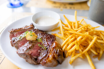 Grill beef steak with French fries in restaurant