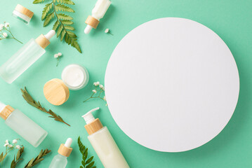 Eco-friendly cosmetic products concept. Above view photo of empty circle with cosmetic containers,...