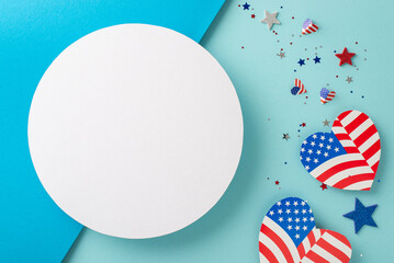 Fototapeta premium Presidents' Day USA artistic greetings. Top view of patriotic decor: hearts with American flag-inspired pattern, glimmering stars, confetti on bicolor blue surface with empty circle for text or ad
