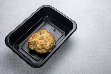 Delicious meat dishes in a black box. Delivery