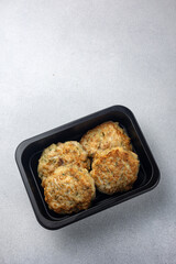 Delicious meat dishes in a black box. Delivery