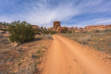 hiking the chesler park loop trail in the needles in canyonlands national park, usa