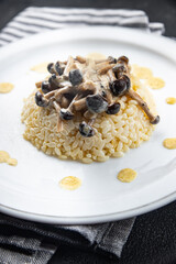 rice mushroom sause risotto meal food snack on the table copy space food background rustic top view