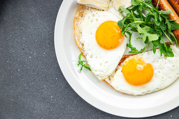 fried egg sausage breakfast green leaves lettuce arugula meal food snack on the table copy space food background rustic top view