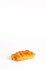 confection bun with raisins on a white background. Copy space.