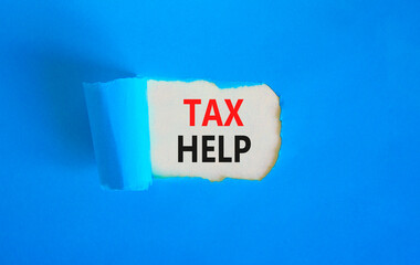 Tax help symbol. Concept words Tax help on beautiful white paper on a beautiful blue background. Business, support and tax help concept. Copy space.