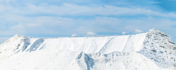 Sea salt piled up into a mountain of the salt production near the town of Aigues-Mortes in the Camarque region of France