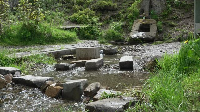 slow motion of the Ilsequelle, the source of the river Ilse in the Rothaargebierge mountains in Germany and is known to holy, sacred and has healing power to those who believe.