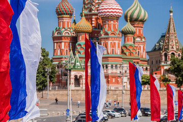 Russia. Moscow. The national flag of the Russian Federation on the background of St. Basil's Cathedral on Vasilievsky Descent. Russian tricolor. The holiday is Russia Day on June 12.