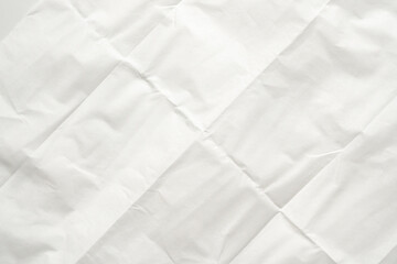 White folded and wrinkled paper texture background