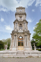 Fototapeta na wymiar Day shot of Dolmabahce Clock Tower, Turkish: Dolmabahce Saat Kulesi, situated outside Dolmabahce Palace, Istanbul, Turkey, in a spring day