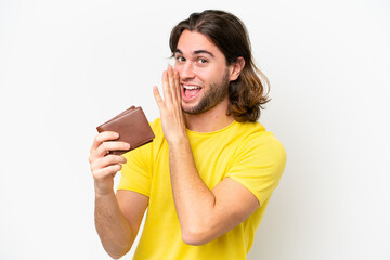 Young handsome man holding a wallet isolated on white background whispering something