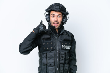 Young caucasian SWAT man isolated on white background making phone gesture. Call me back sign
