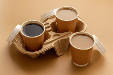 Different types of coffee to go in paper cup with cup holder