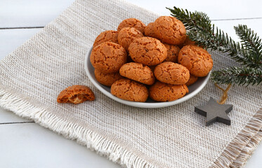 Amaretti Italian almond cookies on a white background with copy space.Famous amarettini cookie biscuits.Delicious Christmas pastry popular in Italy.Selective focus.