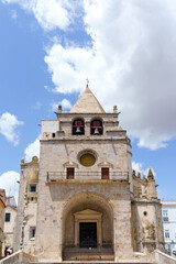 Fototapeta na wymiar cathedral entrance facade arch and bell tower