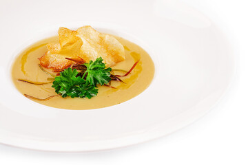Soup of the pumkin with potato chips