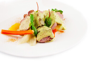 Roasted duck with white sauce on plate