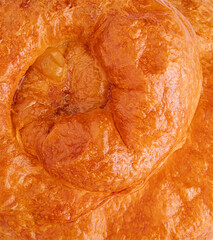 Puff pastry bun rolled up in the form of a snail