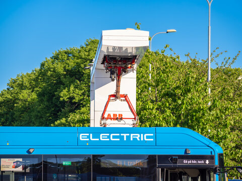 Gothenburg, Sweden - May 30, 2023: One of the Volvo electric buses is being charged at an ABB electric charging station in Gothenburg