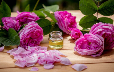 Obraz na płótnie Canvas rose flower and essential oil. spa and aromatherapy
