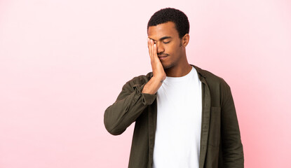 African American man on copyspace pink background with headache