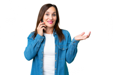 Middle age woman over isolated chroma key background keeping a conversation with the mobile phone with someone