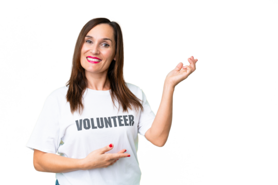 Middle age volunteer woman over isolated chroma key background extending hands to the side for inviting to come