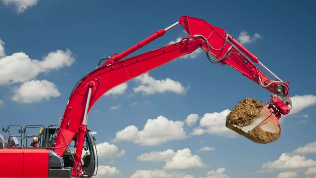 excavator is working on construction site with moving clouds on sky in background