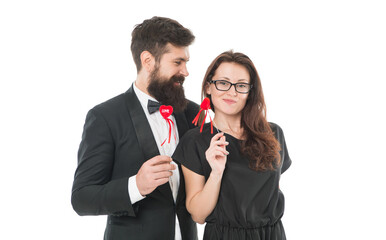 Married couple hold red hearts. Happy relationship concept. Trustful relations. Happy valentines day. Couple in love. Family couple. Bearded man in tuxedo hug elegant woman. Proposal and engagement