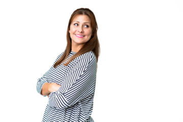 Middle age woman over isolated background with arms crossed and happy