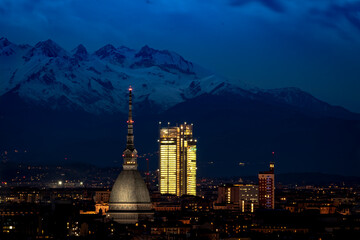 The Mole Antonelliana and the SanPaolo Skyscraper in a nightscape above Turin.