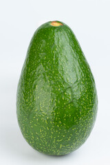 One green fresh avocado