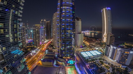 Fototapeta na wymiar Panorama of the Dubai Marina and JBR area and the famous Ferris Wheel aerial day to night timelapse