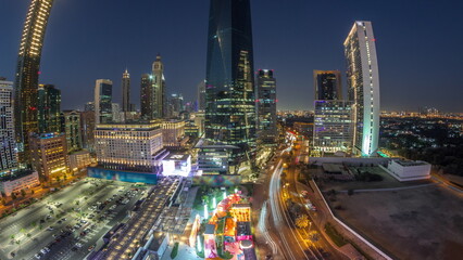 Fototapeta premium Panorama of Dubai International Financial district aerial day to night timelapse. View of business and financial office towers.