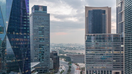 Dubai International Financial district aerial night to day timelapse. View of business office...