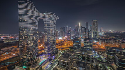 Fototapeta premium Panorama showing futuristic Dubai Downtown and finansial district skyline aerial night timelapse.