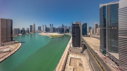 Obraz premium Cityscape skyscrapers of Dubai Business Bay with water canal aerial timelapse.