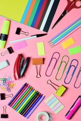 School supplies, various accessories in full color copy space. Zenith view and vertical shot, pink background.
