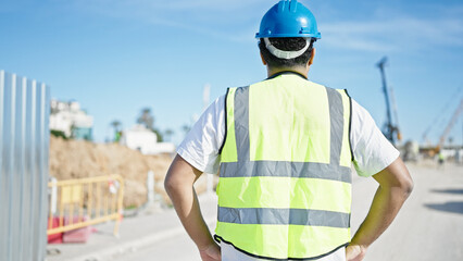African american man builder standing backwards at street