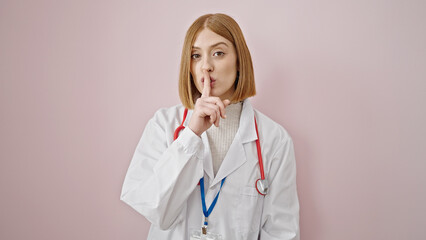Young blonde woman doctor asking for silent over isolated pink background
