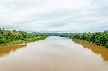 Fototapeta na wymiar River with lush green banks