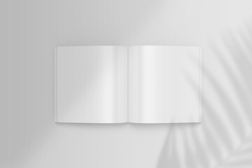 Realistic top view opened square magazine or brochure booklet for stationery and branding. Mockup template with isolated on light grey background and palm leaf shadow overlay. 3D rendering Mock up.