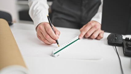 Young hispanic man architect drawing house plans at office
