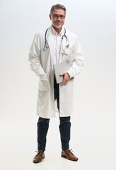 Full length portrait of doctor, general practitioner, physician, medical professional with tablet...