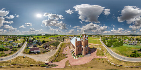 full hdri 360 panorama aerial view on red brick neo gothic catholic church in countryside or village in equirectangular projection with zenith and nadir. VR  AR content